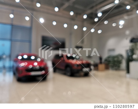 Blurred new car parked in modern showroom waiting for sales. 110280597
