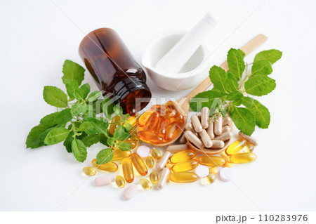 Alternative medicine herbal organic capsule with vitamin E omega 3 fish oil, mineral, drug with herbs leaf natural supplements for healthy good life. Alternative medicine herbal organic capsule with vitamin E omega 3 fish oil, mineral, drug with herbs leaf natural supplements for healthy good life. 110283976