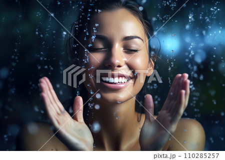 Close-up female portrait of a young attractive caucasian woman laughing and splashing water Close-up female portrait of a young attractive caucasian woman laughing and splashing water 110285257