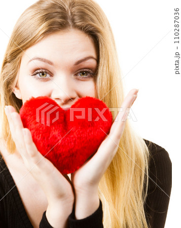 Woman holding red heart Woman holding red heart 110287036