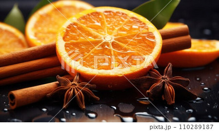 AI-generated content. Fresh orange slices, cinnamon sticks, anise stars on wet glossy black surface, close-up, selective focus. AI-generated content. Fresh orange slices, cinnamon sticks, anise stars on wet glossy black surface, close-up, selective focus. 110289187