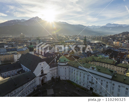 Innsbruck at evening, Aerial Drone Shot of a Beautiful winter City Skyline, Surrounded by Alps Mountains in Austria Innsbruck at evening, Aerial Drone Shot of a Beautiful winter City Skyline, Surrounded by Alps Mountains in Austria 110290325