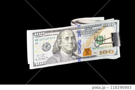 One hundred dollar bills, on a black background One hundred dollar bills, on a black background 110290983