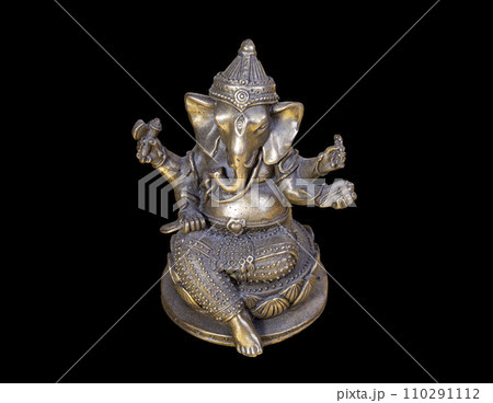 Hindu God Ganesh (Ganesha) Statuette, isolated on a black background 110291112
