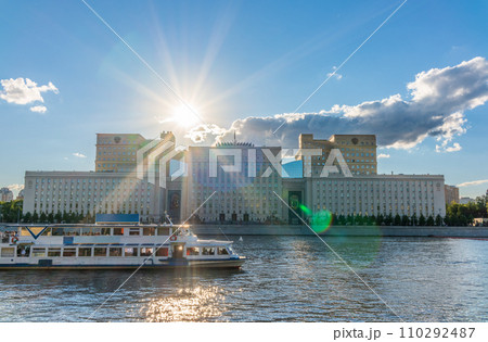 View of the Ministry of Defence of Russian Federation, and Moscow river embakment with cruise ships at sunset. 110292487