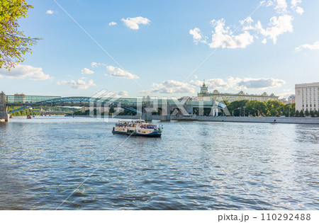 View of the Moscow river embakment, Pushkinsky bridge and cruise ships at sunset. 110292488