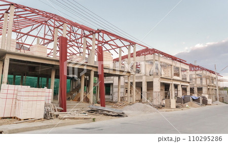construction residential new house in progress at building site construction residential new house in progress at building site 110295286