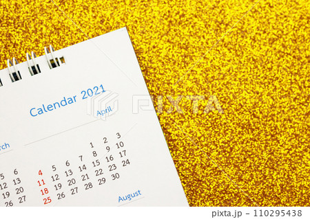 Happy new year 2021 calendar page close up on gold glitter sparkle background Happy new year 2021 calendar page close up on gold glitter sparkle background 110295438