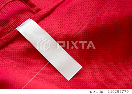 White blank clothes label on red jersey texture background White blank clothes label on red jersey texture background 110295770