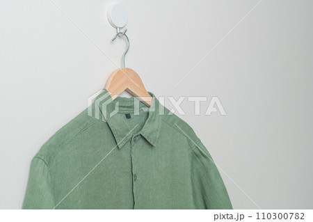 hanging shirt with wood hanger on wall hanging shirt with wood hanger on wall 110300782