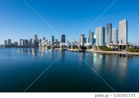 City of Miami, Florida reflected in calm water of Biscayne Bay on sunny morning. 110301135