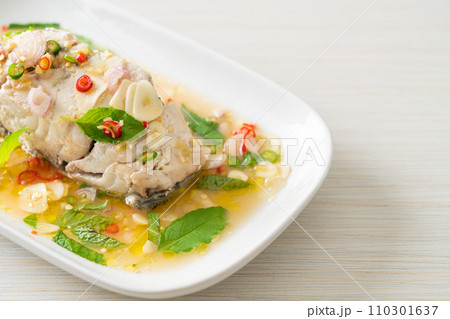 steamed sea bass fish with herbs 110301637