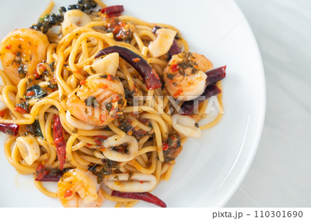spicy spaghetti seafood on plate 110301690