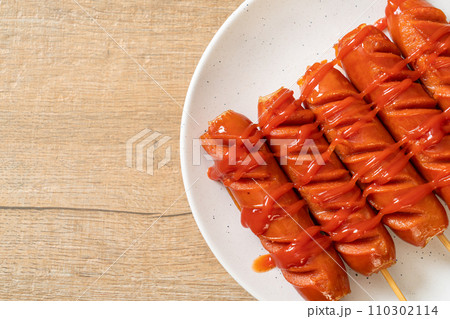 fried sausage skewer with ketchup 110302114