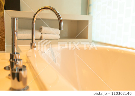 close up tap on bath tub close up tap on bath tub 110302140