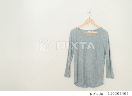t-shirt hanging with wood hanger 110302465