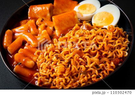 Korean instant noodles with Korean rice cake and fish cake and boiled egg 110302470