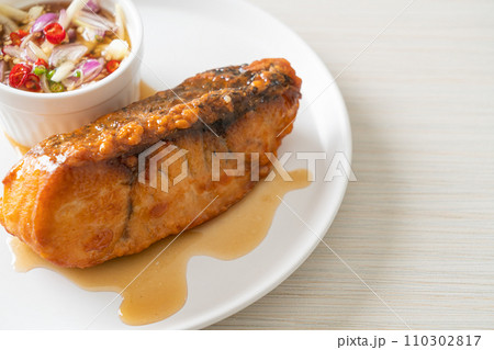 fried snapper fish with fish sauce and spicy salad fried snapper fish with fish sauce and spicy salad 110302817