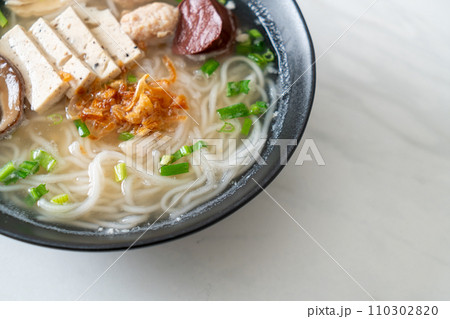 Vietnamese Rice Noodles Soup with Vietnamese Sausage served vegetables and crispy onion Vietnamese Rice Noodles Soup with Vietnamese Sausage served vegetables and crispy onion 110302820