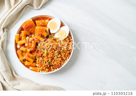 Korean instant noodles with Korean rice cake and fish cake and boiled egg Korean instant noodles with Korean rice cake and fish cake and boiled egg 110303218