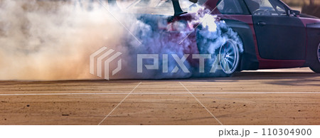 Drift car burning tires on speed track. Drift car burning tires on speed track. 110304900