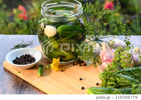 a set of ingredients for pickling cucumbers, pickled cucumbers, brine. a set of ingredients for pickling cucumbers, pickled cucumbers, brine. 110306779
