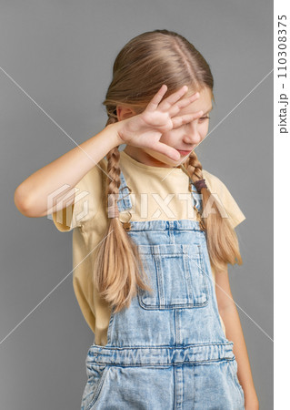 A little girl shows a sign of  protest with her hand 110308375