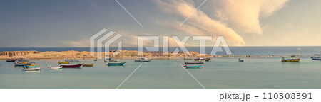 Weathered fishing boats bob on waves, colorful hulls contrasting with dramatic clouds, Alexandria, Egypt Weathered fishing boats bob on waves, colorful hulls contrasting with dramatic clouds, Alexandria, Egypt 110308391