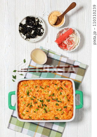 sushi bake with salmon, rice, seaweed, crab meat 110310239