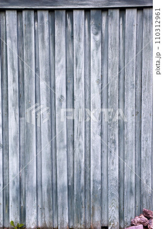 The background is made of green wooden boards. Wooden fence. Old boards. The background is made of green wooden boards. Wooden fence. Old boards. 110312961