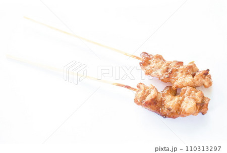 roasted slice chicken dressing Japanese teriyaki sauce stabbing wooden stick on white background 110313297