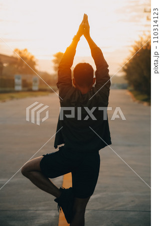 Athlete runner feet running on road, Jogging concept at outdoors. Man running for exercise..Athlete runner feet running on road, Jogging concept at outdoors. Man running for exercise. 110314123