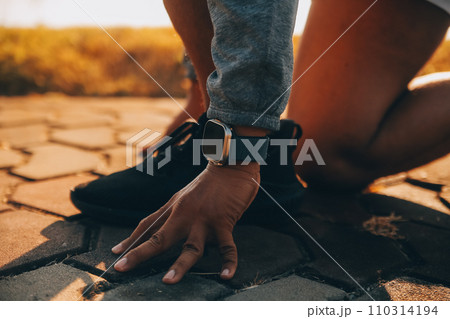 Athlete runner feet running on road, Jogging concept at outdoors. Man running for exercise..Athlete runner feet running on road, Jogging concept at outdoors. Man running for exercise. 110314194