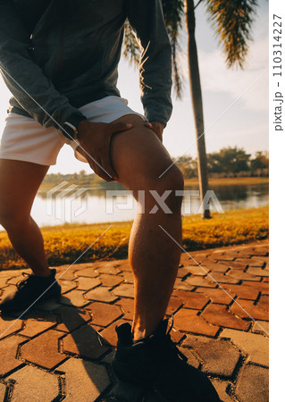 Athlete runner feet running on road, Jogging concept at outdoors. Man running for exercise..Athlete runner feet running on road, Jogging concept at outdoors. Man running for exercise. 110314227