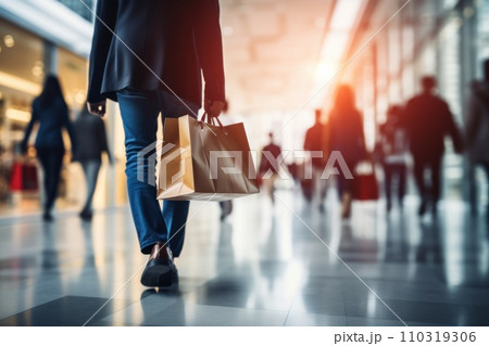 AI-generated content. Blurred background of a modern shopping mall with some shoppers. Generative AI AI-generated content. Blurred background of a modern shopping mall with some shoppers. Generative AI 110319306