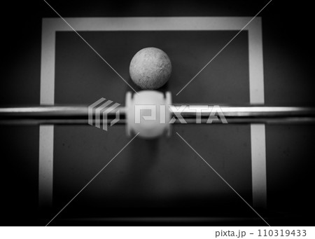 top view on a foosball goalie blocking the ball insider the box 110319433