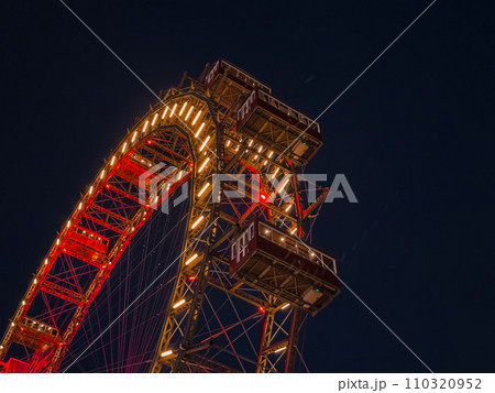 A ferris wheel at night. A ferris wheel at night. 110320952
