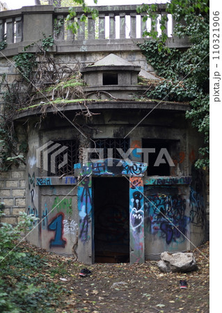 Abandoned building with graffiti on walls 110321906