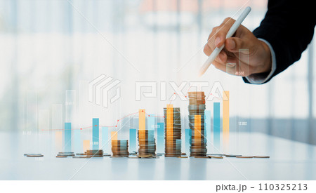 Coin stack with digital graphic indicator symbolize business investment. Shrewd Coin stack with digital graphic indicator symbolize business investment. Shrewd 110325213