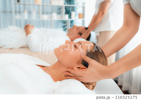 Caucasian couple enjoying relaxing anti-stress head massage. Quiescent 110325275