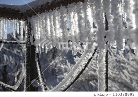 icicles and Snow on the old balcony railing icicles and Snow on the old balcony railing 110328995