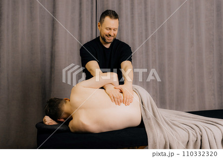 image of physiotherapist massaging man in hospital image of physiotherapist massaging man in hospital 110332320