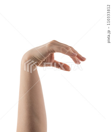 Young woman hand holding something with fingers isolated on white background 110333812