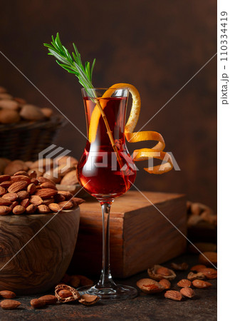 Italian liqueur Amaretto with almonds nuts. 110334419