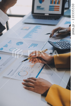 Financial analysts analyze business financial reports on a digital tablet planning investment project during a discussion at a meeting of corporate showing the results of their successful teamwork. Financial analysts analyze business financial reports on a digital tablet planning investment project during a discussion at a meeting of corporate showing the results of their successful teamwork. 110335330