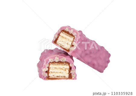 Pink chocolate crispy brocken bar with wildberry taste isolated on the white 110335928