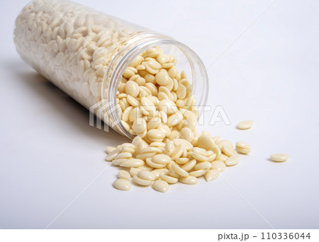 spa wax for depilation in granular form on the white background spa wax for depilation in granular form on the white background 110336044
