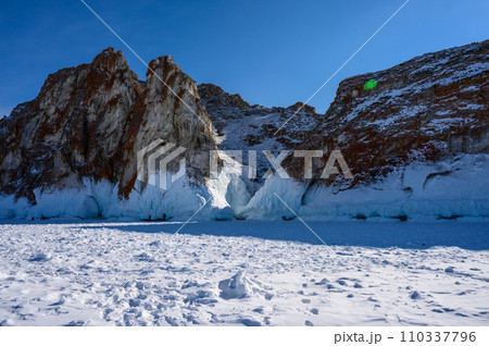 Cape Three Brothers. Beautiful winter landscape of frozen Baikal Lake. 110337796