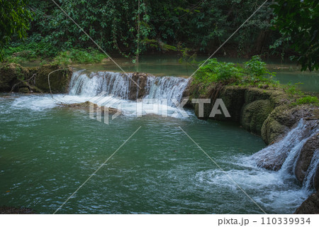 Tropical river in evening. Muak Lek River and banyan trees with bizarre roots in Chet Sao Noi National Park, Thailand. 110339934