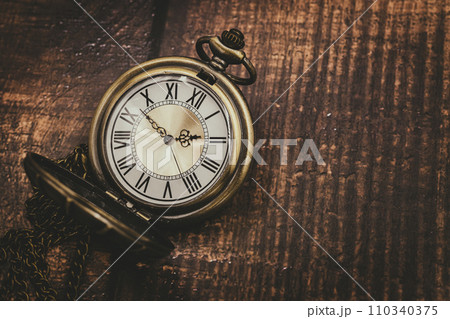 old pocket watch classic clock time vintage retro style on wood background with space for text old pocket watch classic clock time vintage retro style on wood background with space for text 110340375